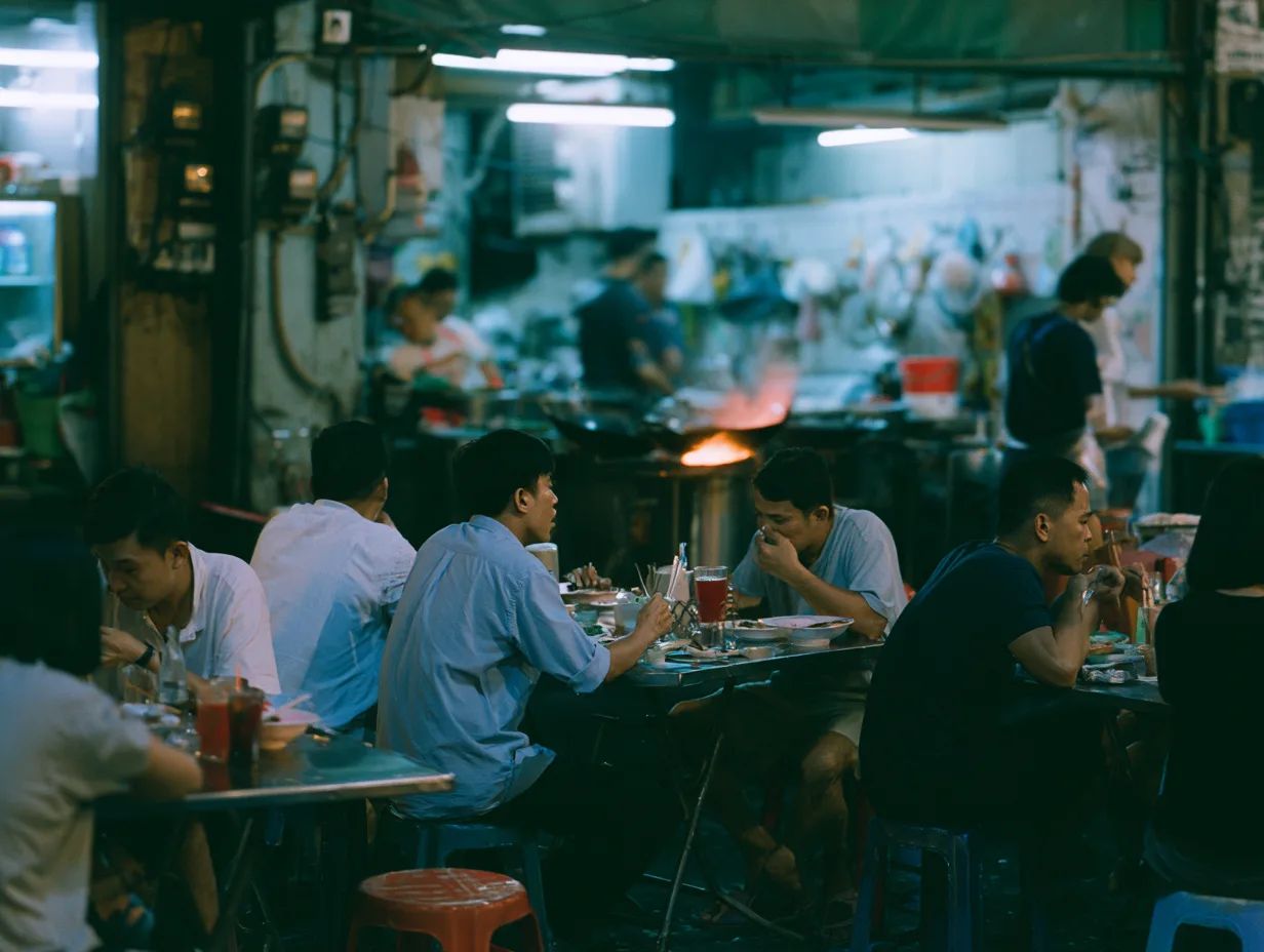 A Bangkok street food vendor serving customers
