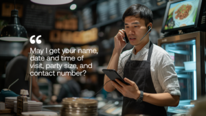 Photo of a waiter taking a phone call
